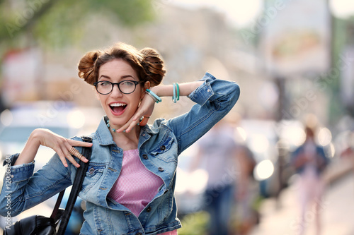 Playful young woman on blur...