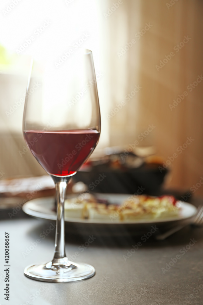 Glass of wine and grilled vegetables on served table Glass of wine and grilled vegetables on served table
