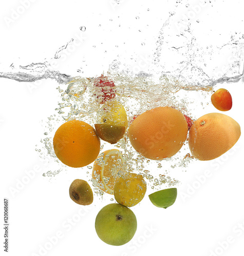 Fototapeta Naklejka Na Ścianę i Meble -  Fruits  falling into water on white background