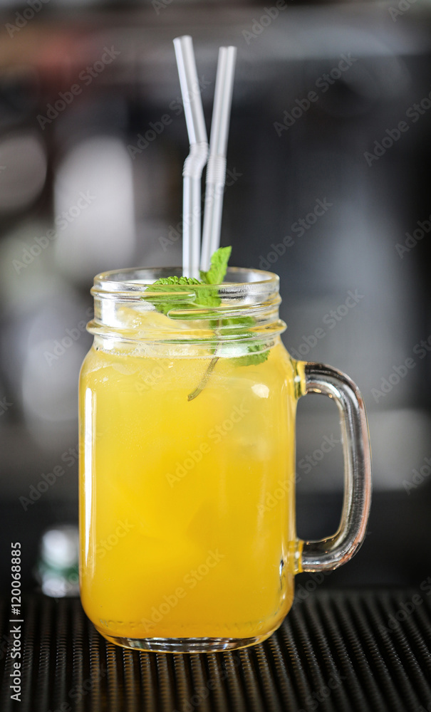 Cocktail in glass jar on bar counter Cocktail in glass jar on bar counter