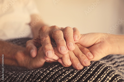 Old male and young female hands, closeup