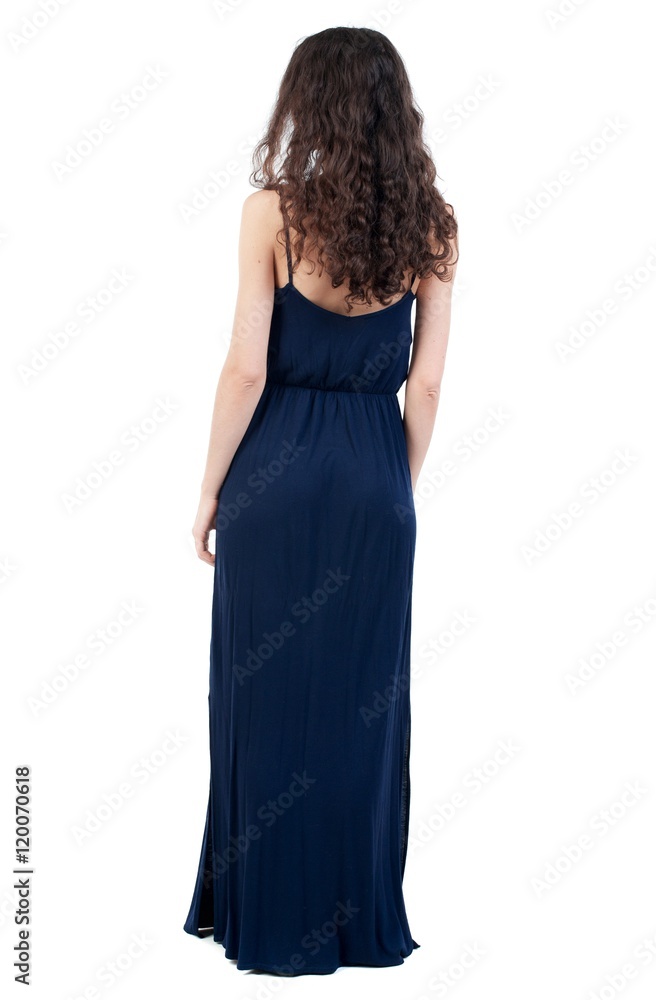 back view of standing young beautiful woman. Curly dark girl is back in an evening dress. back view of standing young beautiful woman. Curly dark girl is back in an evening dress.