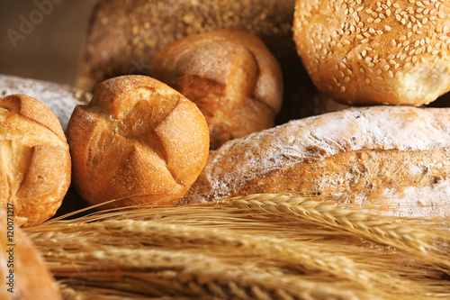 Variety of wheat bread and spikes, close up