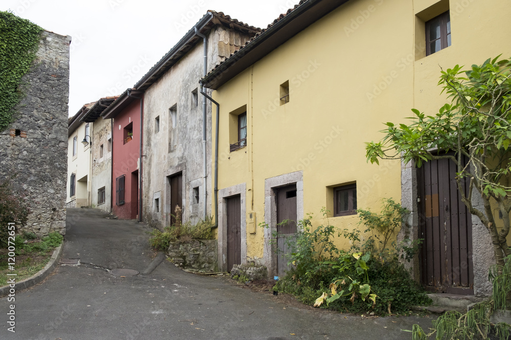 Old houses in the street in Llanes, Asturias, Spain.