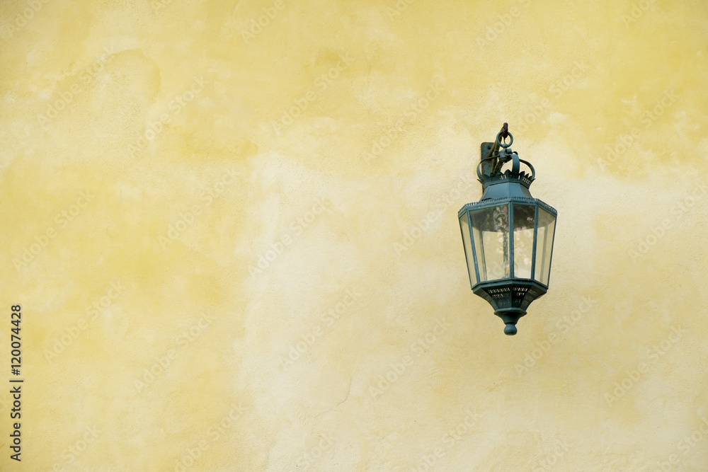 Front view of a light fixture hanging on awall. Front view of a light fixture hanging on awall.