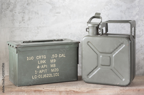 Fotografia still life photography : old Army green jerrycan ( fuel canister ) and bullet bo