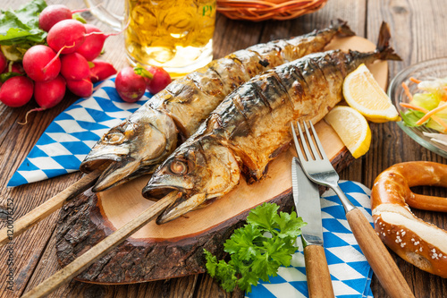 Photography Grilled mackerel fish with beer and pretzel