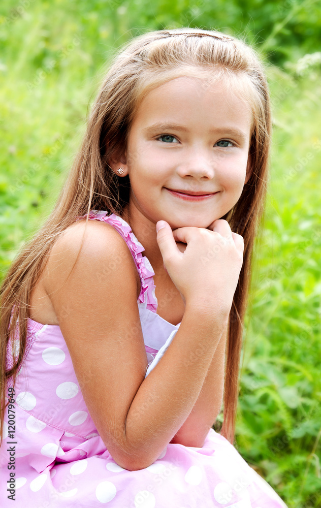 Portrait of adorable smiling little girl in summer day Portrait of adorable smiling little girl in summer day