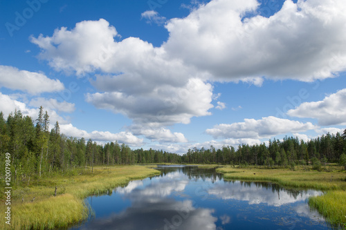scenic lake with clouds in finland © olivercesarritz