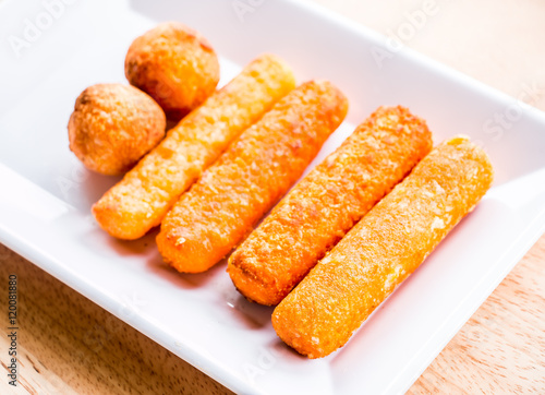 cheese stick and ball on plate