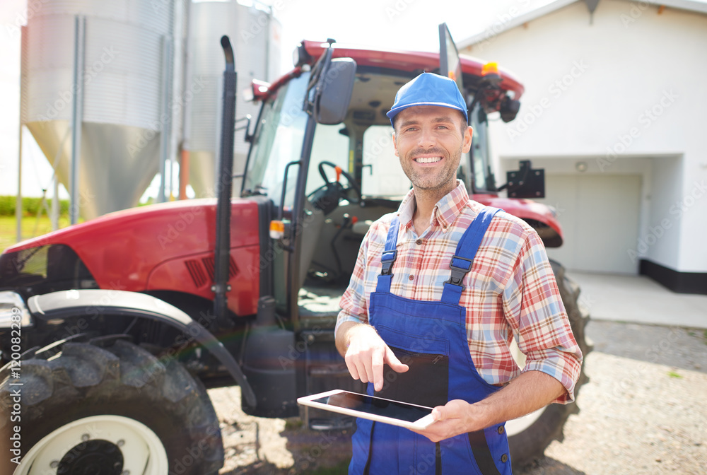 Fototapeta premium Modern farmer on his mechanized farm