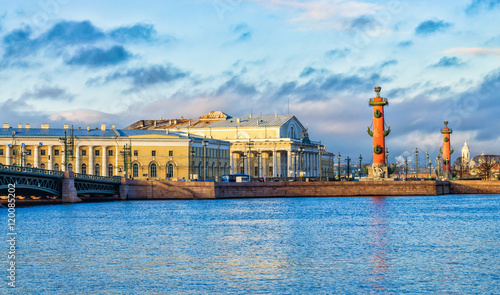 Saint Petersburg, Russia. The view of the Spit of Vasilievsky island with the Old Stoch Exchange building and the Rostral columns at very cloudy winter day. Shot from the opposite side of the river.