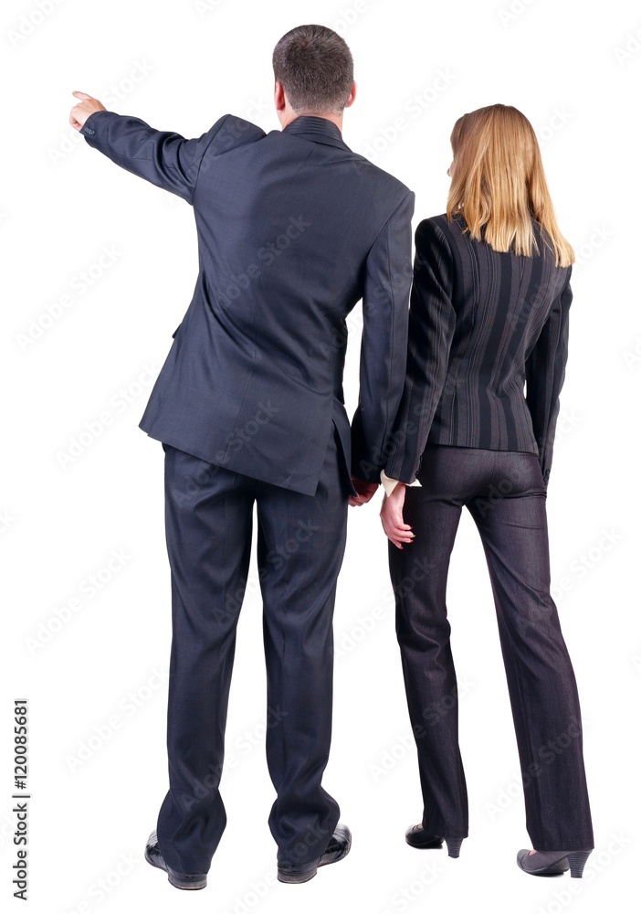 Back view of  pointing business team. young couple (man and woman) . beautiful friendly girl and guy in suit together. Rear view people collection. backside view of person. Isolated over white