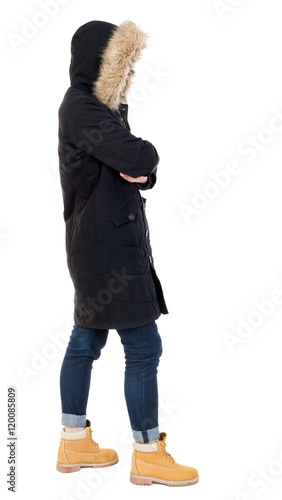 Back view woman in winter jacket  looking up.   Standing young girl in parka. Rear view people collection.  backside view of person.  Isolated over white background. © ghoststone