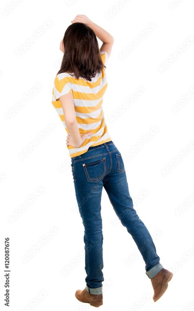back view of standing young beautiful brunette woman in yellow t-shirt. girl watching. Rear view people collection. backside view of person. Isolated over white background. back view of standing young beautiful brunette woman in yellow t-shirt. girl watching. Rear view people collection. backside view of person. Isolated over white background.
