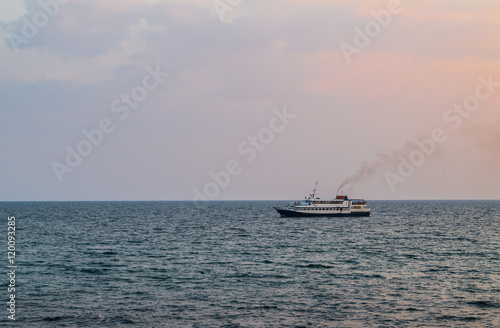 The ship in the evening calm sea
