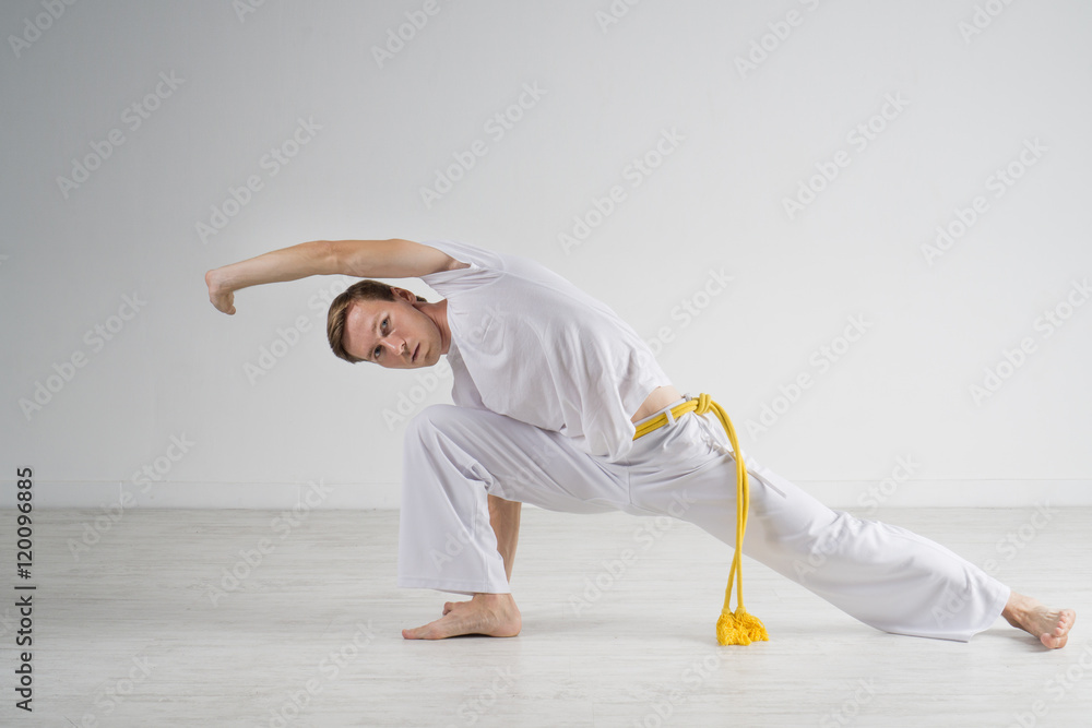 Naklejka premium Man practicing Capoeira , brazilian martial Art.