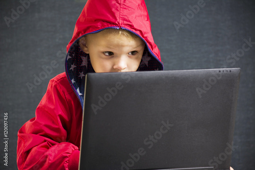 boy playing laptop