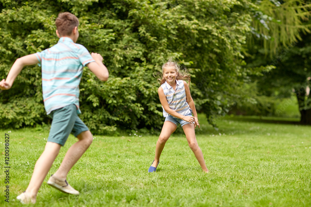happy kids running and playing game outdoors happy kids running and playing game outdoors