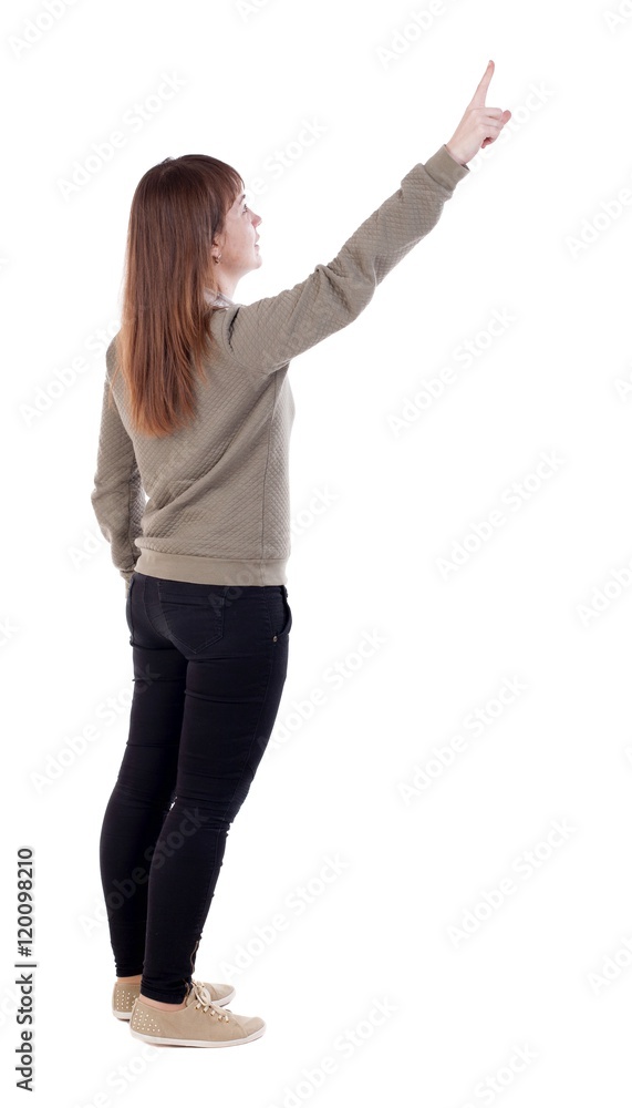 Back view of pointing woman. beautiful girl. Rear view people collection. backside view of person. Isolated over white background. Back view of pointing woman. beautiful girl. Rear view people collection. backside view of person. Isolated over white background.