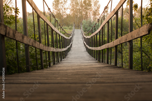 Fototapeta Naklejka Na Ścianę i Meble -   Suspended wooden bridge