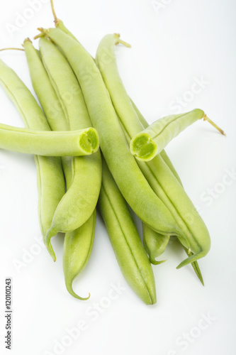 green beans on a white background. color image of green vegetables side view