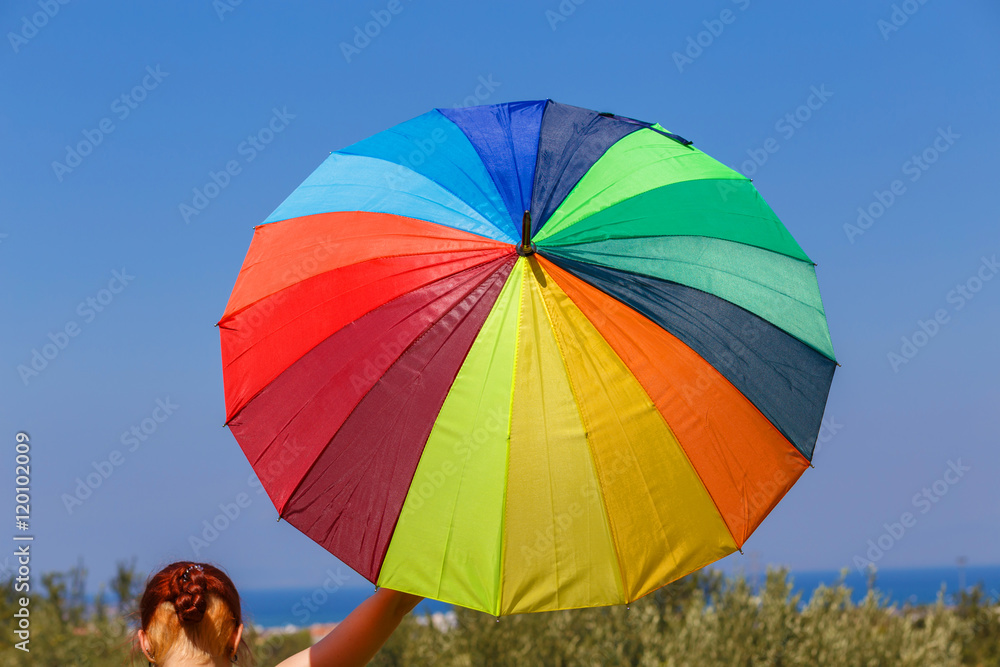 Girl with multicolored umbrella