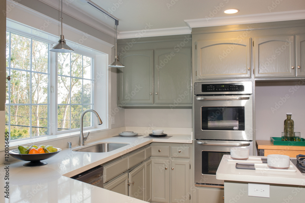Interior of modern kitchen in white blue gray tones and new stai Interior of modern kitchen in white blue gray tones and new stai