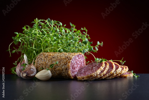 sliced salami with thyme and garlic
