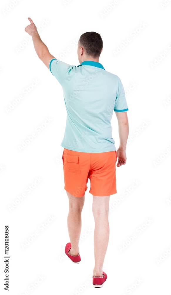 Back view of going handsome man in shorts. walking young guy . Rear view people collection. backside view of person. Isolated over white background. Back view of going handsome man in shorts. walking young guy . Rear view people collection. backside view of person. Isolated over white background.