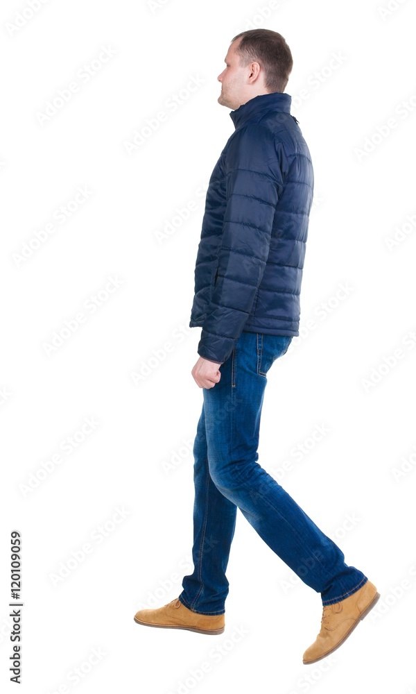 Fototapeta premium Back view of going handsome man in jeans and jacket. walking young guy . Rear view people collection. backside view of person. Isolated over white background.