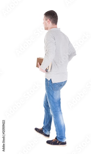 man goes and has a stack of books. back view. Rear view people collection. backside view of person. Isolated over white background.