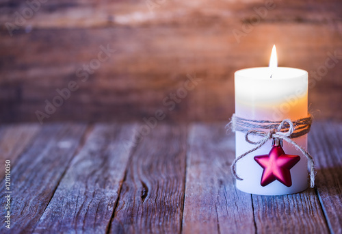 Christmas background with burning candle