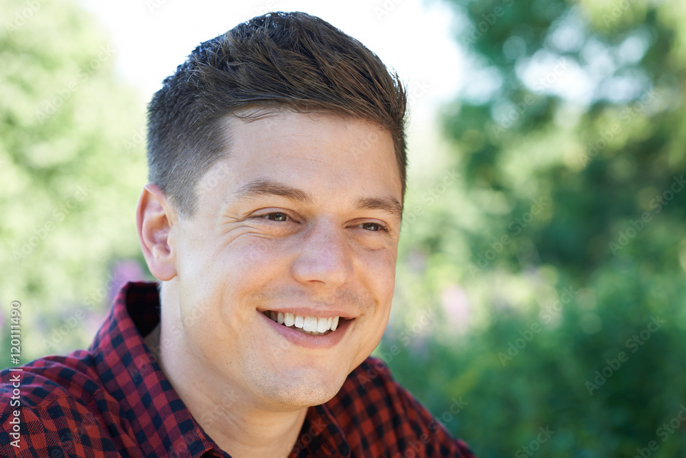 Outdoor Head And Shoulders Portrait Of Smiling Man Outdoor Head And Shoulders Portrait Of Smiling Man