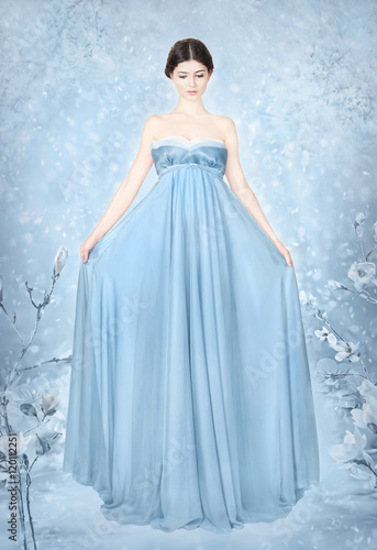 Woman in blue bridal dress - fantasy winter 