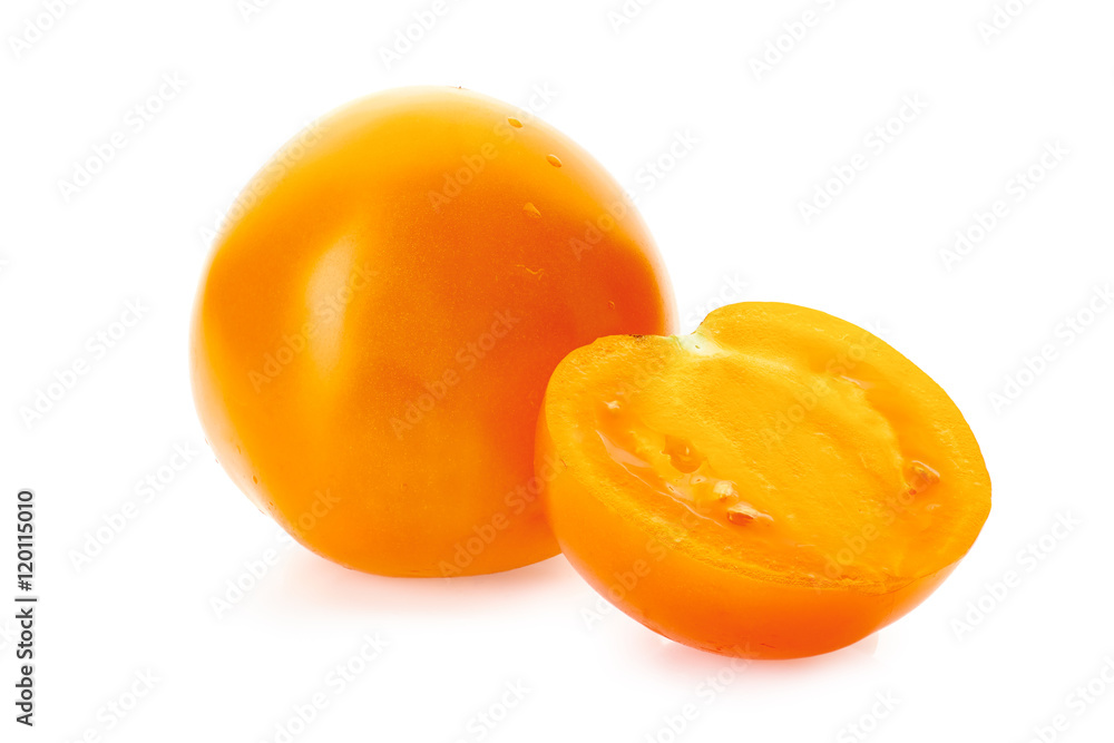 Yellow tomatoe with half slice on white Yellow tomatoe with half slice on white