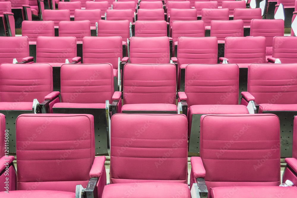 Red seat rows in a bright lecture room. Red seat rows in a bright lecture room.