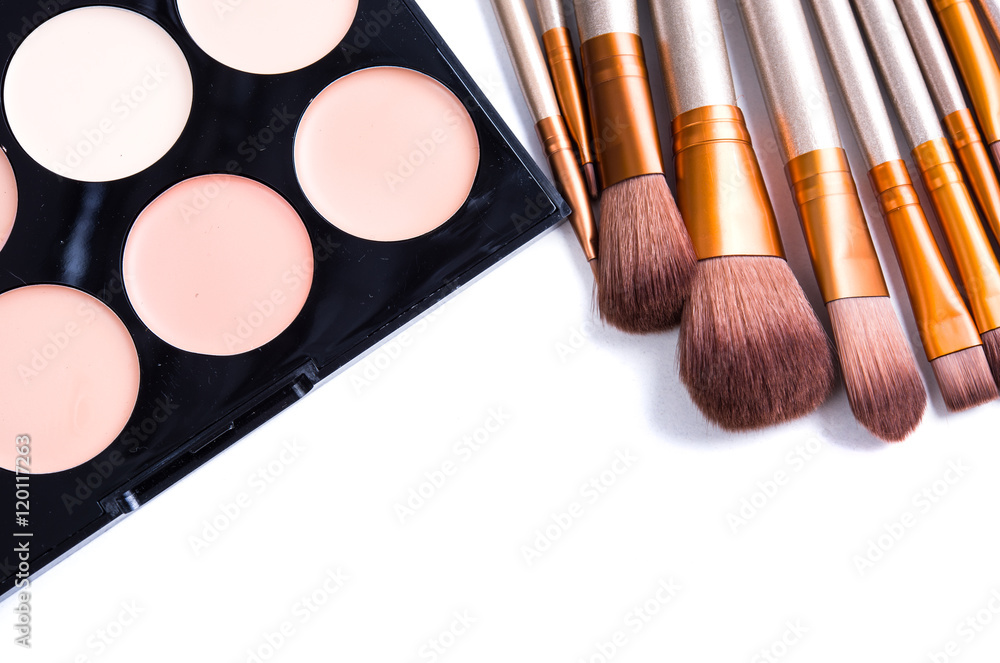 Makeup brushes set and foundation cream isolated Makeup brushes set and foundation cream isolated