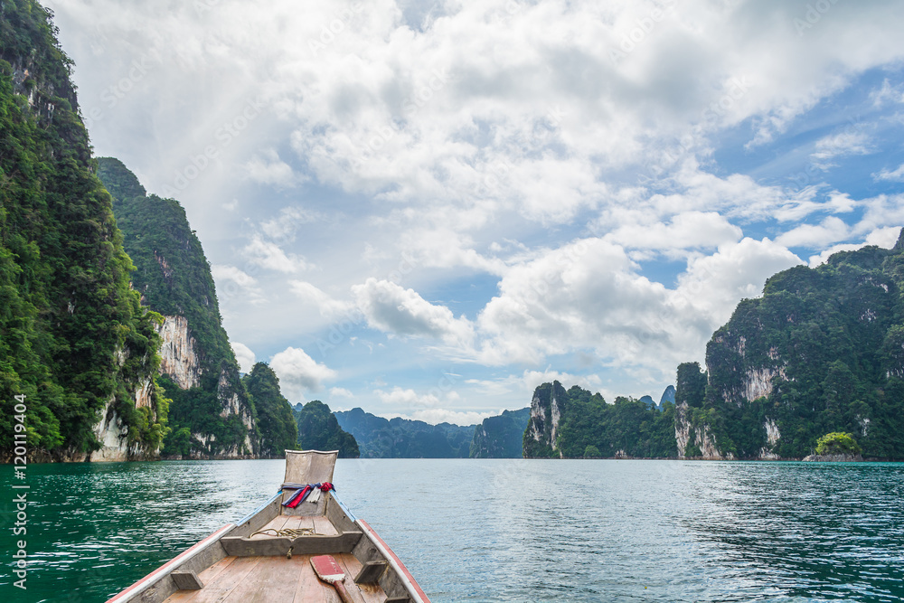 Fototapeta premium Wooden boat in Ratchaprapha dam, Surat Thani, Thailand.