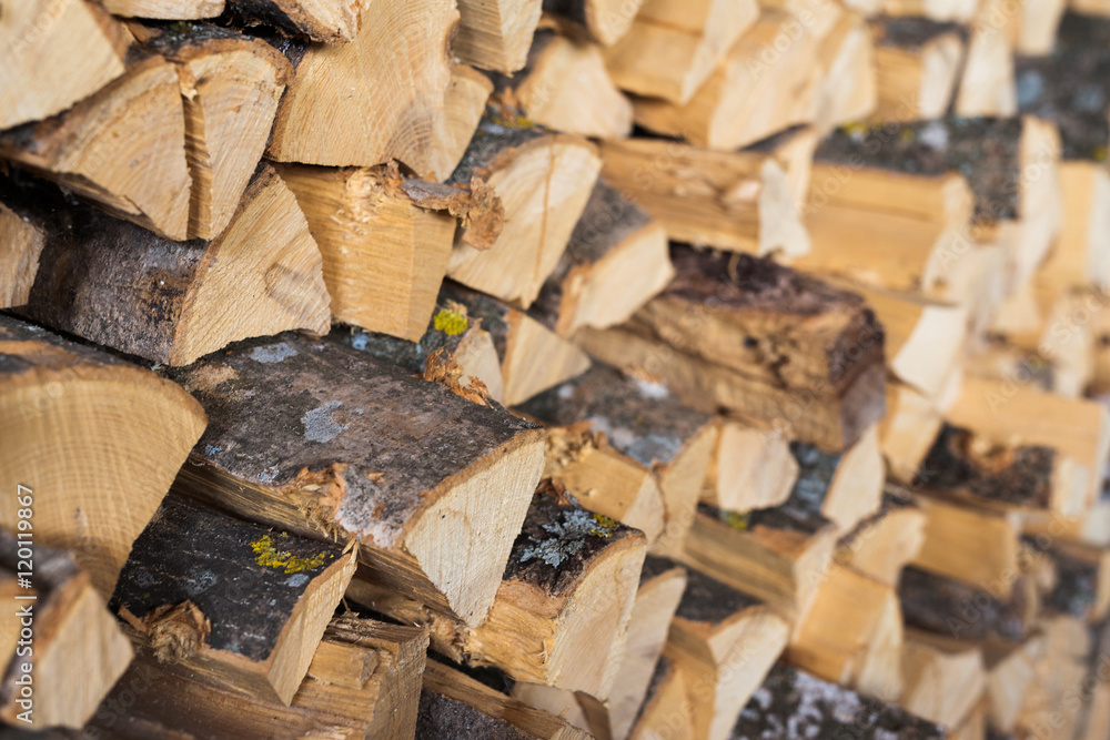Chopped brown firewood, stacked and ready for winter