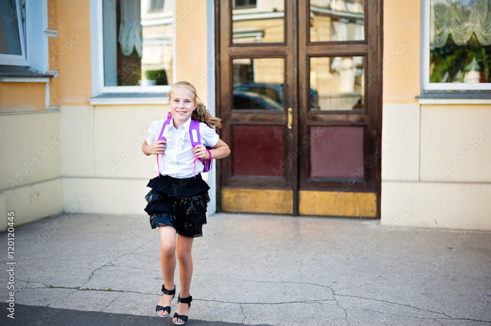 happy little girl running home from school