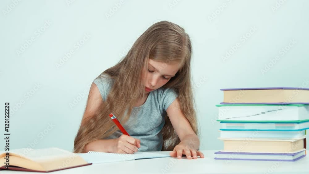 Girl something writing in her notebook. Panning Girl something writing in her notebook. Panning