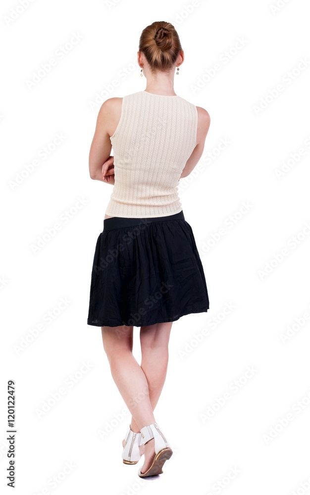 Naklejka premium back view of standing young blonde woman. Rear view people collection. backside view of person. Isolated over white background.