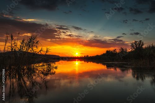 Fototapeta Naklejka Na Ścianę i Meble -  Sunset scene on lake