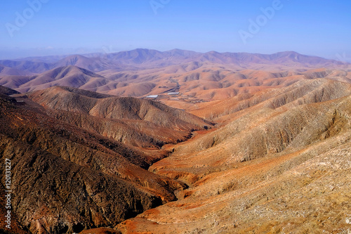 View on the mountains of an unusual red-orange color. © Elena Krivorotova
