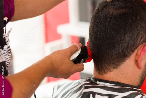 After scissors, man asked the machine for hair cut, close up of short hair