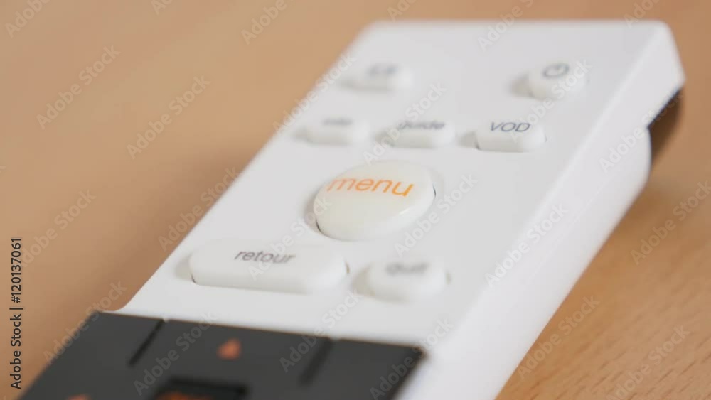 Multimedia device MENU button pressing with finger 4K 2160p 30fps UltraHD footage - White modern remote controller choosing options while tilting 4K 3840X2160 UHD video Multimedia device MENU button pressing with finger 4K 2160p 30fps UltraHD footage - White modern remote controller choosing options while tilting 4K 3840X2160 UHD video