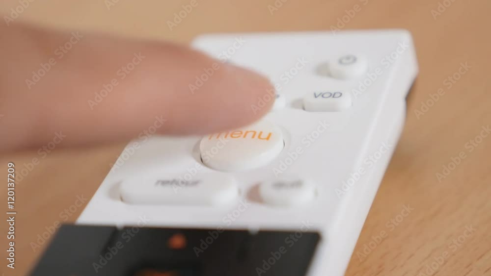 Modern multimedia device MENU button pressing with finger 4K 2160p 30fps UltraHD footage - White remote controller choosing options while tilting 4K 3840X2160 UHD video Modern multimedia device MENU button pressing with finger 4K 2160p 30fps UltraHD footage - White remote controller choosing options while tilting 4K 3840X2160 UHD video