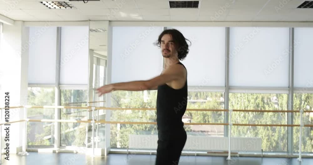 Dancing man modern ballet dancer performs dance in studio Dancing man modern ballet dancer performs dance in studio