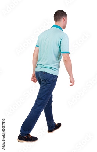 Back view of going handsome man in jeans and a shirt. walking young guy . Rear view people collection. backside view of person. Isolated over white background.